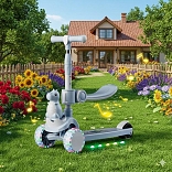 SCOOTER CON ASIENTO MODELO »DINOSAURIO« MUSICAL Y LUCES